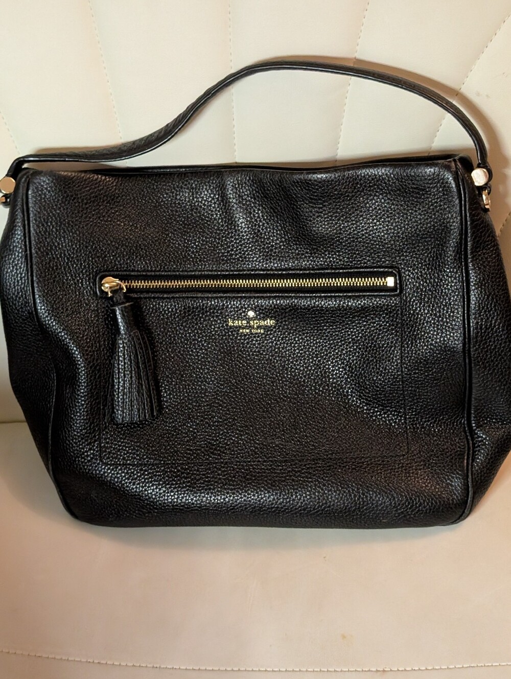 Kate Spade New York “Chester Street Michaela” pebbled black leather bag.